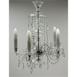 A glass chandelier, with five curved branches with drip pans and droppers, approximately H69cm. 