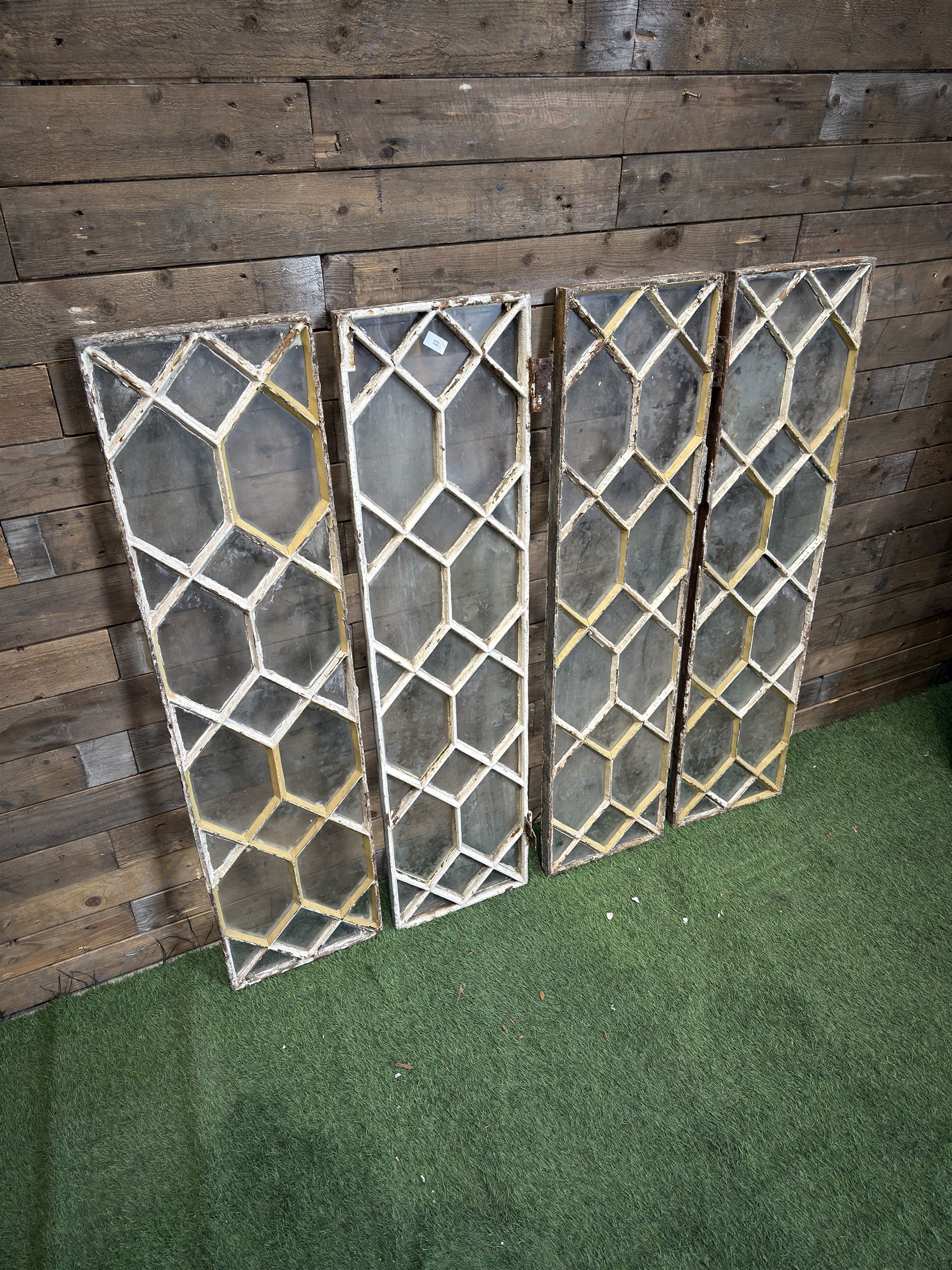 Four 19th century cast iron windows, lattice glazed in white painted finish, 