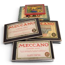Early 20th century Meccano outfits, comprising 'Engineering in Miniature' set no. 1, 'Engineering for Boys' set no. 0, Accessory Outfit no. 1A, Accessory Outfit no. 3A and one other