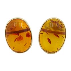 Pair of 9ct gold oval Baltic amber stud earrings, hallmarked 