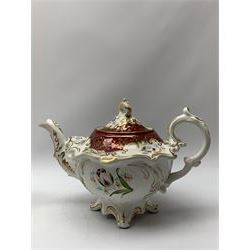Early 19th century tea service, comprising teapot, six tea cups and six saucers, lidded twin handled sucrier, slop bowl, cream jug, and sandwich plate, decorated with hand painted floral sprays, claret border and gilt foliate detail, a number of pieces marked beneath with pattern no 1190, together with a similar pair of early 19th century teacups and saucers 