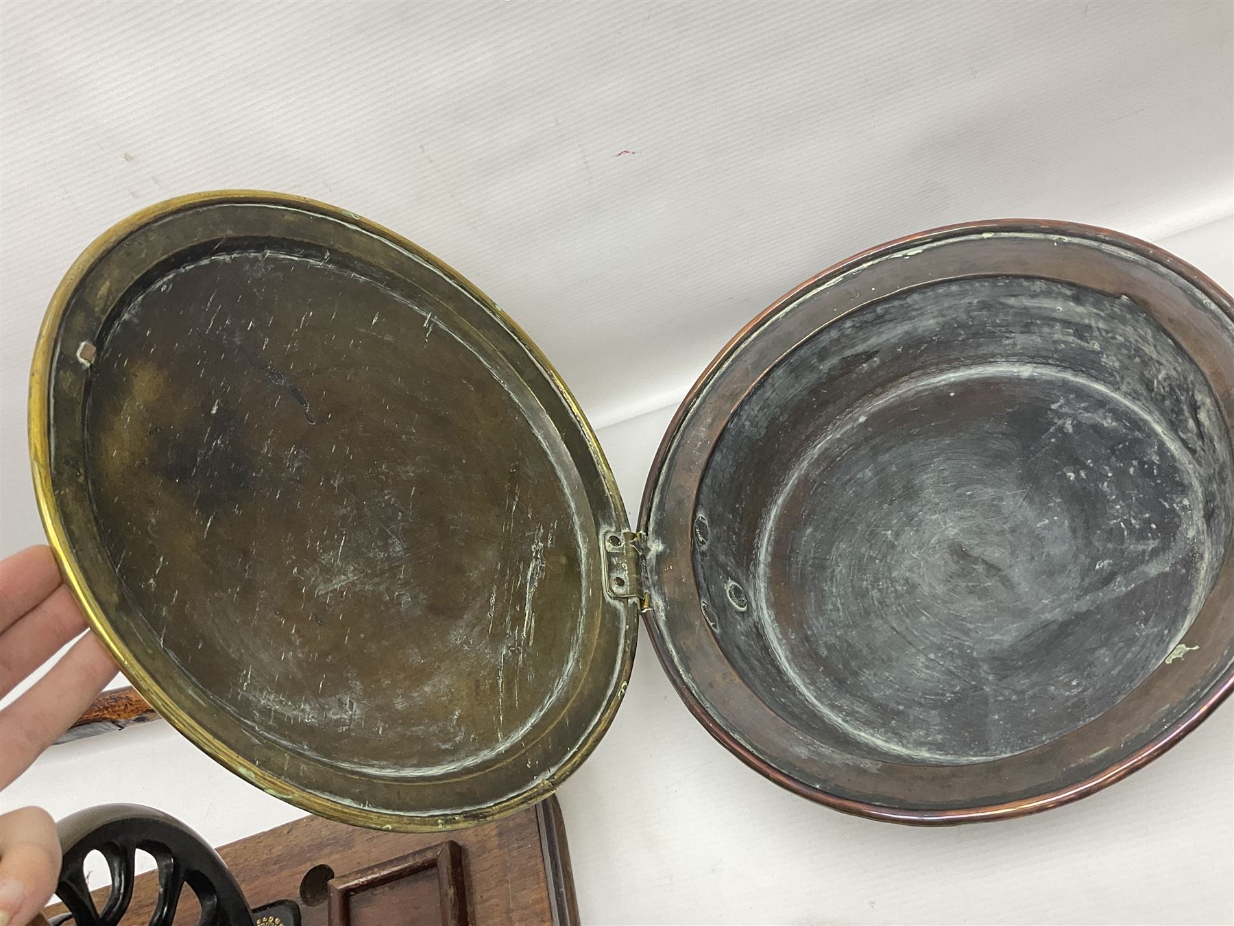 Cased sewing machine, together with bed warmer and copper hunting horn