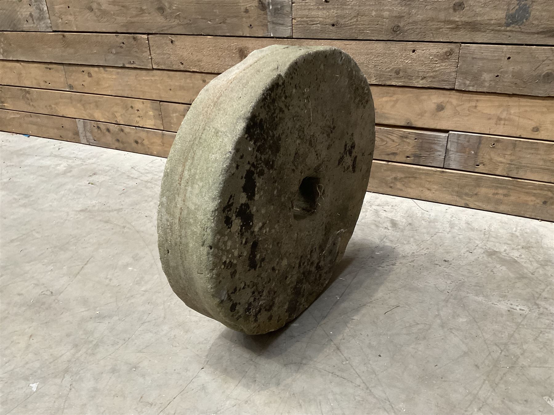 19th century circular stone mill wheel,