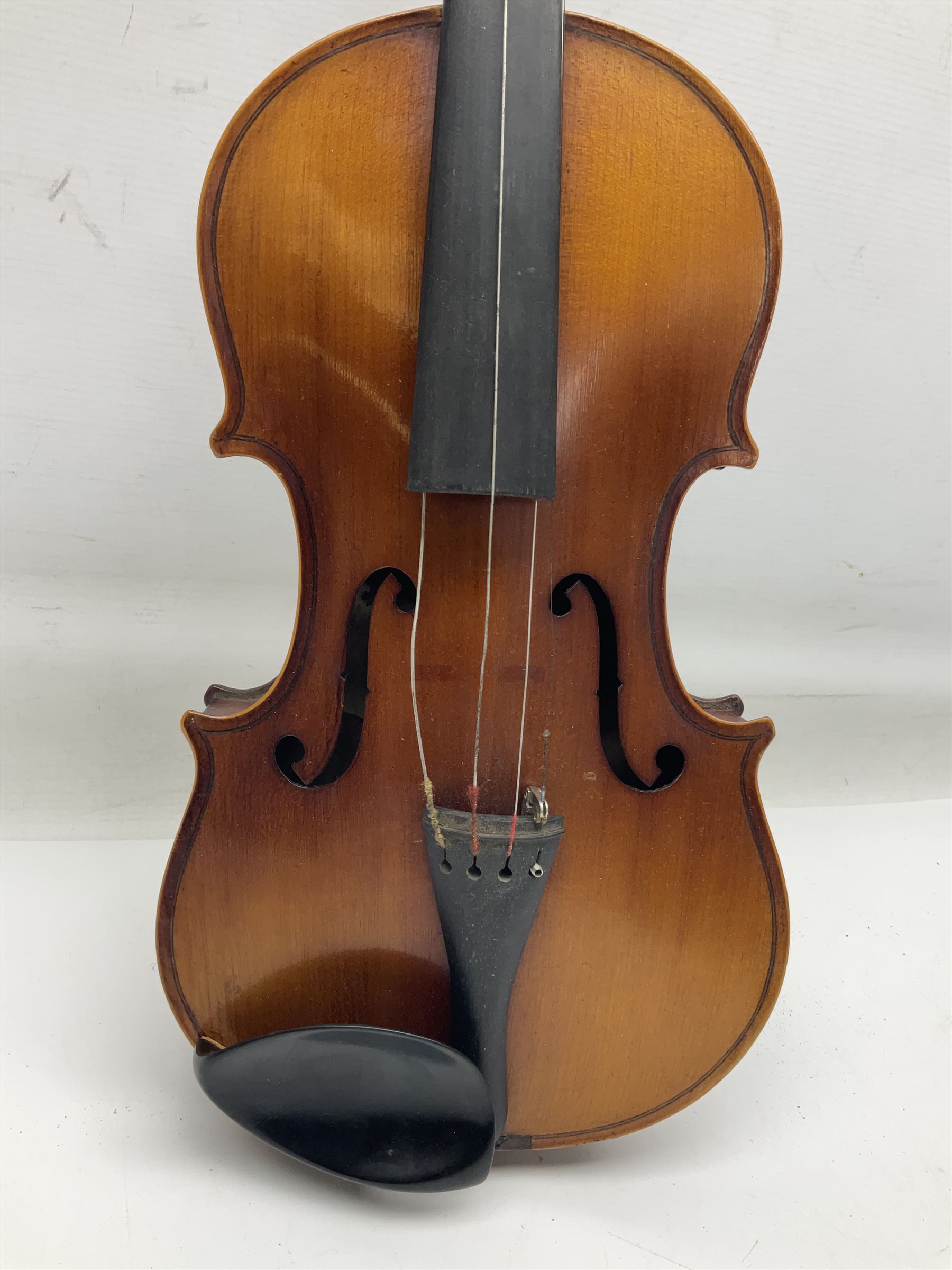 Saxony (?) violin c1950 with 36cm two-piece maple back and ribs and spruce top; bears label 'The Maidstone School Orchestra Association' L59cm overall; and 1950s Czechoslovakian violin for restoration; both in carrying cases (2)