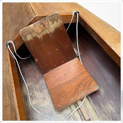 Mid-20th century varnished marine plywood two-person touring kayak, the decked hull with pointed bow and stern, two circular Holt-Allen access hatches and central open cockpit fitted with seats