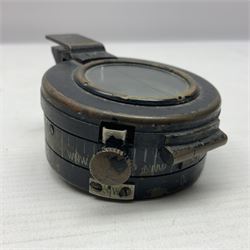 WWII British marching compass, the black lacquered brass case inscribed T.G.Co.Ltd. No.B100228 (broad arrow) 1941 Mk.III; and a ship's brass cased clinometer, the silvered dial marked R(arrow)L, D9cm; in leather carrying case (2)