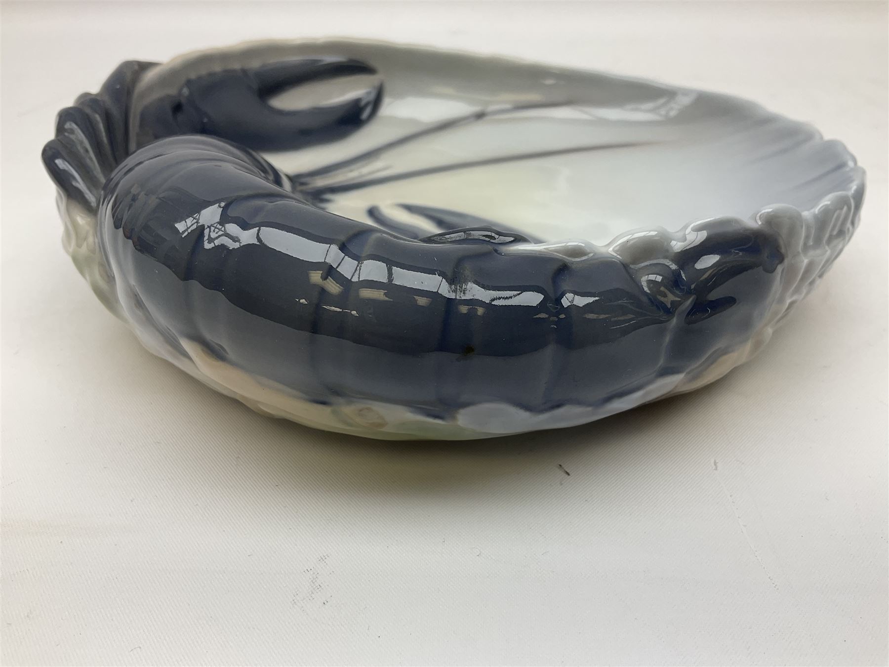 Pair of Royal Copenhagen bowls modelled as baskets and mounted with lobsters, model no 3498 and 3277, with painted and printed marks beneath, largest D19cm