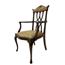 Edwardian walnut open armchair, raised shaped cresting rail over interlacing back with carved capitals, upholstered serpentine seat, on cabriole supports