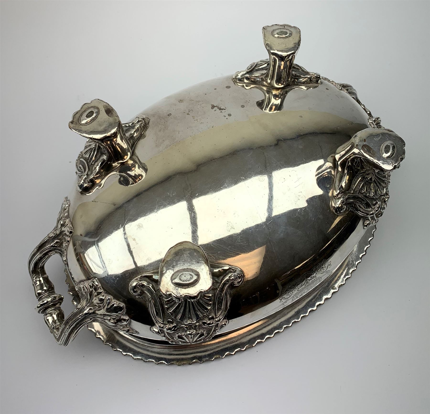 Matthew Boulton silver plated tureen and cover, the body of oval form with twin handles engraved with crest, probably for Whitgreave/Whitgrave family of Moseley Staffordshire, 'Regem Defendere Victum', (To defend the king even in his defeat/To defend the conquered king ), upon four paw feet, the cover with gadrooned rim and foliate loop handle 