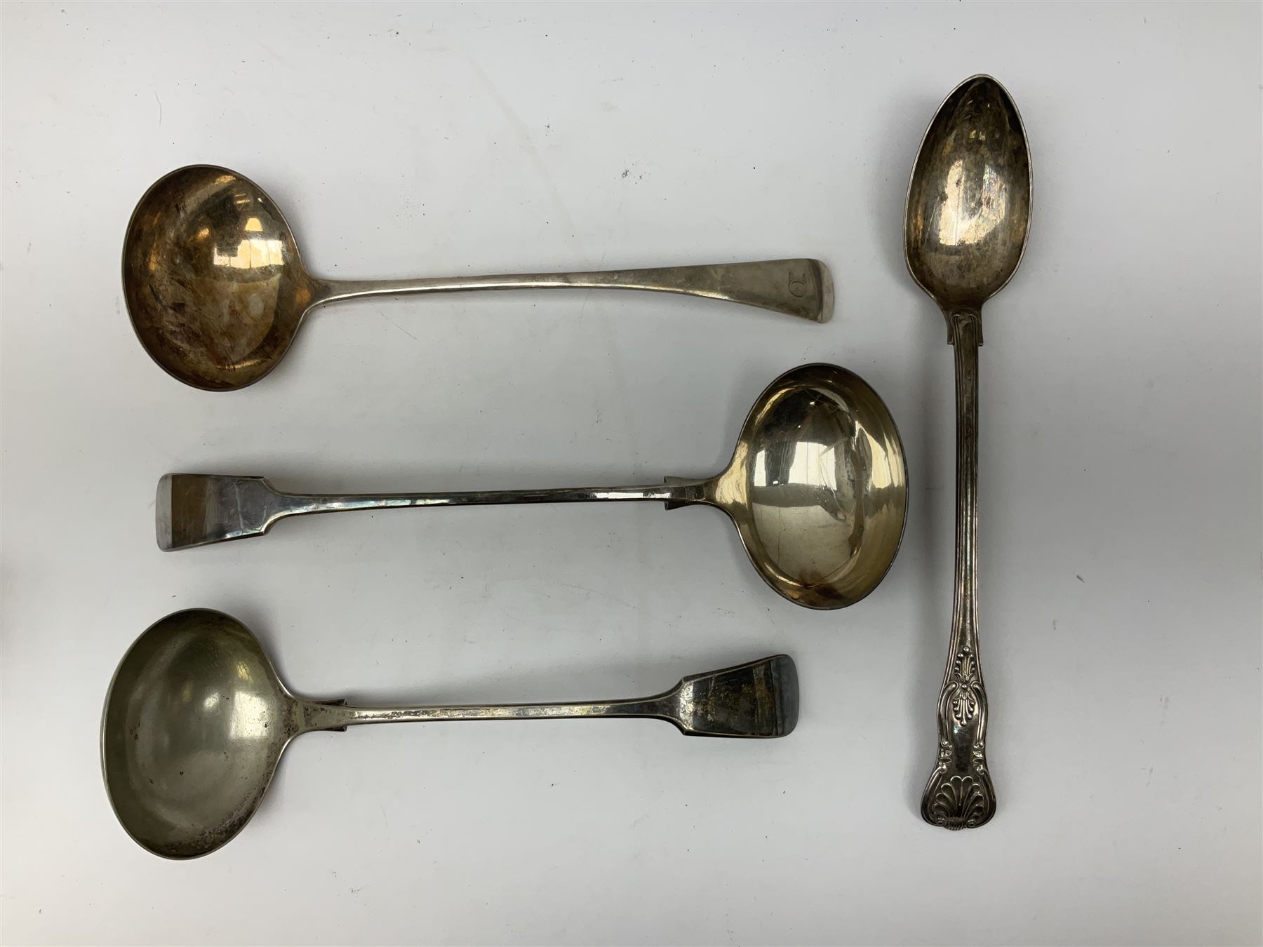 Two silver plated Fiddle pattern soup ladles, a silver plated Old English pattern soup ladle, and a silver plated Kings pattern basting spoon, (4)