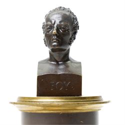 French 19th-century bronze inkwell surmounted by a bust of General Maximilien-Sébastien Foy, the cylindrical column applied with gilt-metal martial trophies and a classical caduceus of Hermes, emblematic of eloquence, commerce and diplomacy, raised on a brass socle cast with a scale pattern, on a square bronze base, the interior fitted with two glass inkwells and bronze pounce pot, H19cm