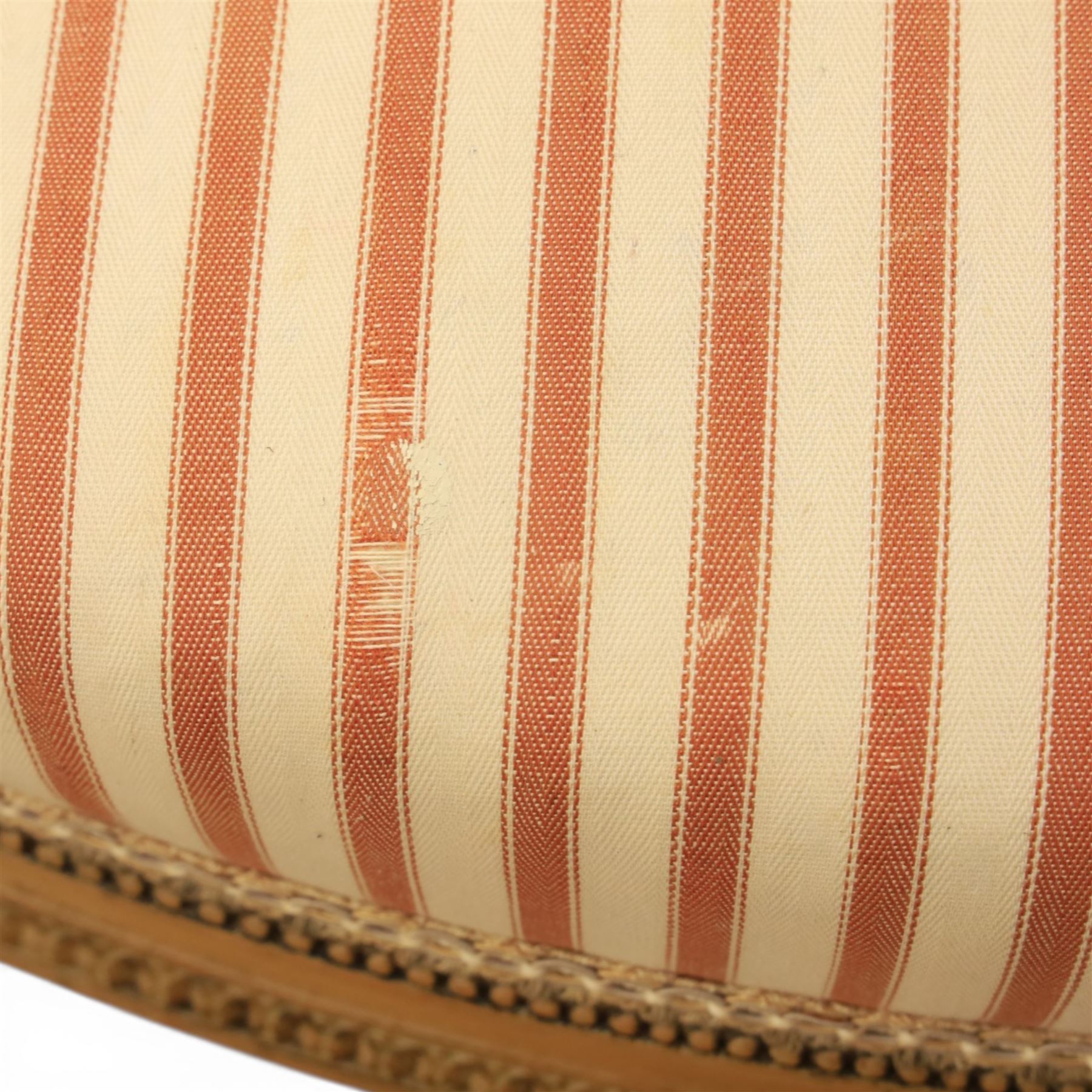 20th century Louis XVI style beech salon suite, comprising settee and four chairs, the settee with shaped rectangular back and upholstered arms over a shaped seat, the chairs with rectangular backs and overstuffed seats, each upholstered in striped fabric with close-nailed borders, upon fluted tapering supports headed by carved paterae, terminating in toupie feet, chairs H89cm W47cm