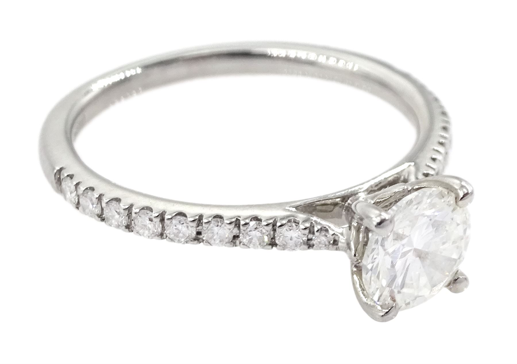 18ct white gold single stone round brilliant cut diamond ring, with diamond set shoulders, hallmarked, principal diamond 0.71 carat, with with International Gemological Institute report