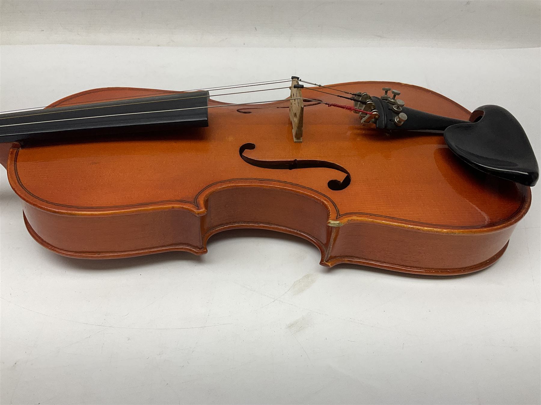 Four student violins - two Chinese three-quarter size with 33.5cm and 34cm two-piece backs; Stringers of Edinburgh quarter size with 28cm two-piece back; and Stentor quarter size with 28cm two-piece back; each in carrying case (4)