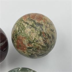 Eight mineral specimens spheres, comprising jasper red, spotted agate, unakite, sardonyx, petrified wood, Serpentine, Larvikite and green Aventurine 