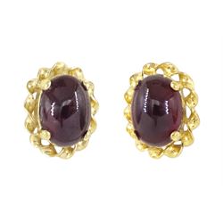 Pair of 9ct gold cabochon garnet stud earrings, stamped