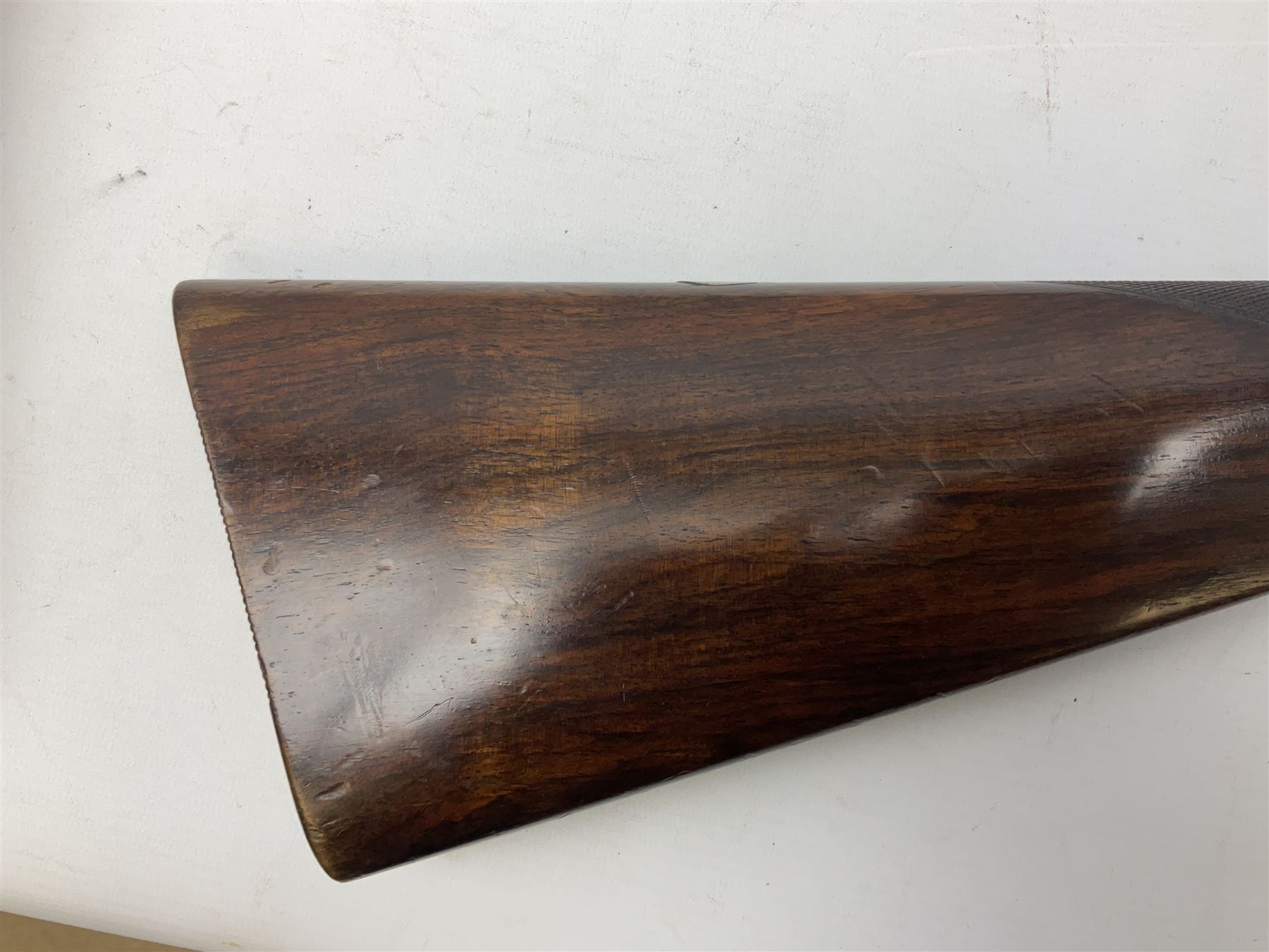 Smith Midgley Bradford 12-bore side-by-side double barrel side-lock ejector shotgun with 71cm barrels, engraved action with patented top lever, ivy leaf fences and top safety, walnut stock with chequered grip and fore-end, serial no.62409 to barrels and 1481 to action, L115cm overall SHOTGUN CERTIFICATE REQUIRED