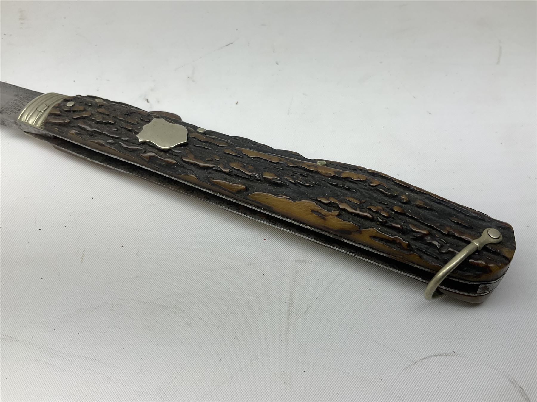 Hunting knife by J Nowill & Sons, Sheffield, the handle inset with mother of pearl, blade length 19cm; George Wolstenholme IXL lock-knife with antler scales L29cm open; and another Bowie style hunting knife marked 'V.R. Warranted Sheffield Joseph Ellis & Sons' in leather sheath (3)