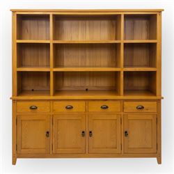 Cotswold & Co - modern light oak dresser, the upper section with open shelving and divided compartments, the base fitted with four drawers over four panelled cupboard doors with metal handles