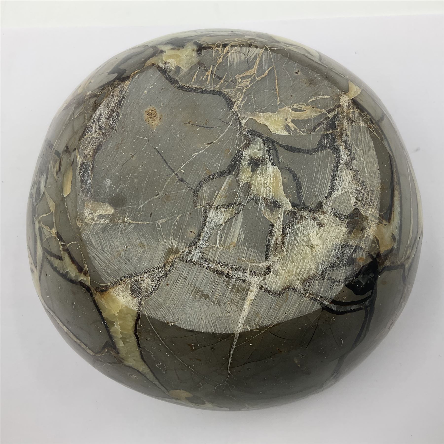 Polished septarian bowl, with a calcite and siderite within limestone rock, D16cm H8cm