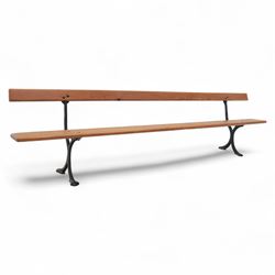 Pine garden bench, with stained and weatherproof varnish, single slat pine seat and back, raised on curved black cast iron supports