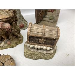 Seven Terry Pratchett Discworld figures by Clarecraft, to include The Luggage DW04M Smugli D990, pair of Home Sweet Home bookends, wall hanging modelled as a dragon upon stone plinth etc, tallest H19cm