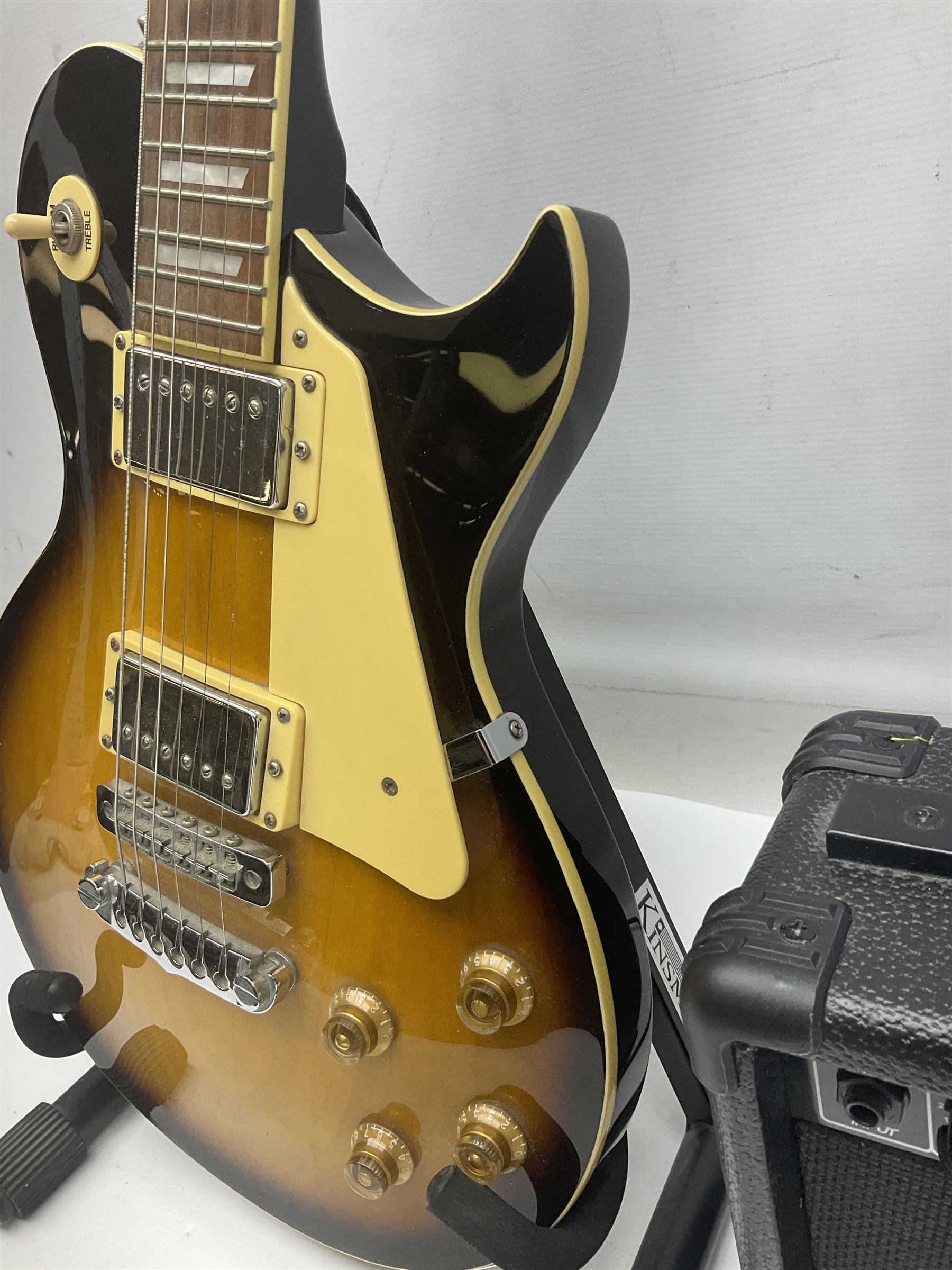 Aria Les Paul style electric guitar, no.037704CH L102cm; with amplifier, soft carrying case and stand; together with various guitar songbooks etc