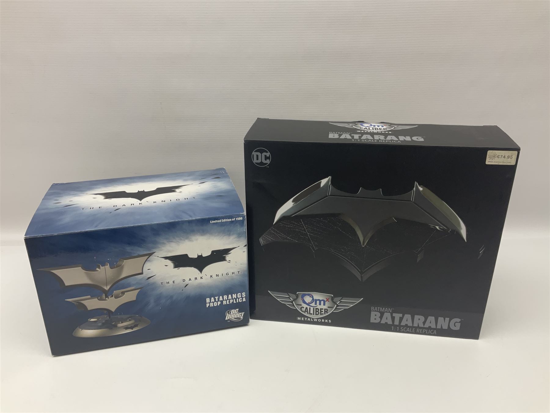 Two Batman replica Batarangs comprising DC Comics QMX Caliber Metalworks 1:1 scale replica with original box, and DC Direct The Dark Knight prop replica no. 33/1500 with original box and certificate of authenticity 