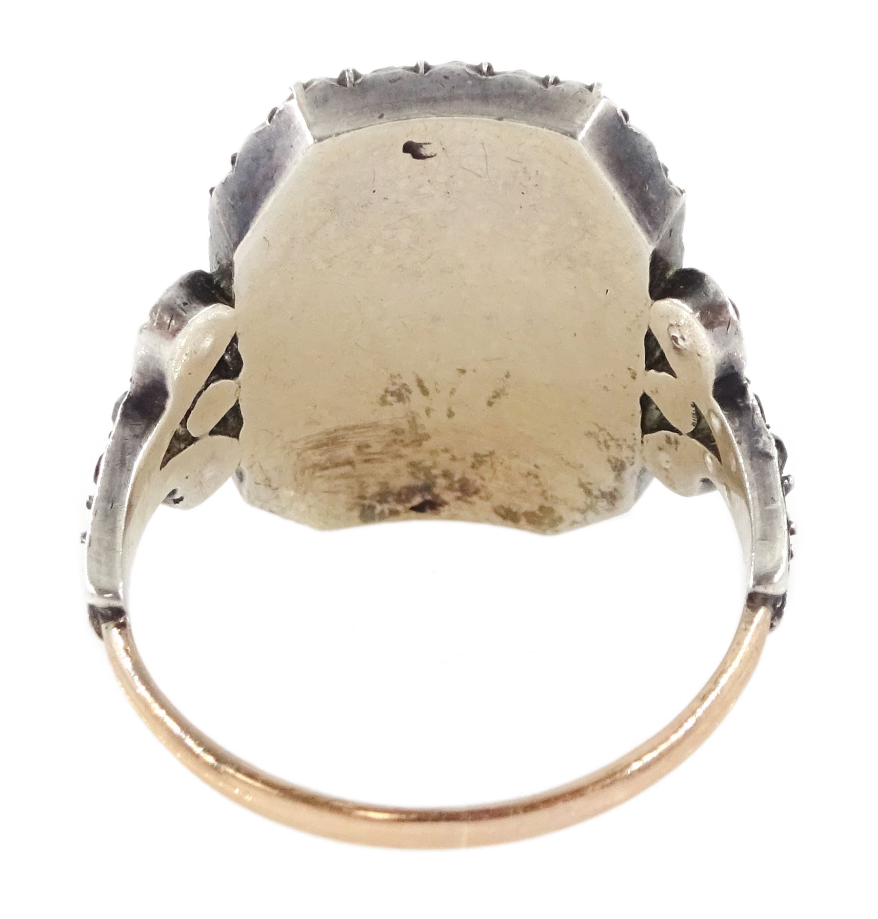 19th century 18ct gold and silver paste set portrait ring, octagonal miniature of a woman on ivory, under a glazed panel, with paste stone surround, to bifurcated paste set shoulders. This lot has been registered for sale under Section 10 of the APHA Ivory Act