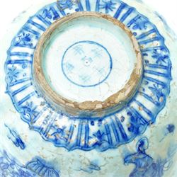 17th century Persian Safavid bowl decorated in the Chinese manner in blue and white with figures and flowers and with pseudo Chinese marks D23cm