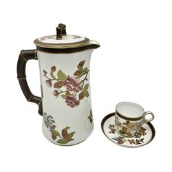 Royal Worcester coffee pot, coffee cup and saucer, all decorated with floral sprigs and butterflies, the coffee pot with a bamboo handle, H23cm