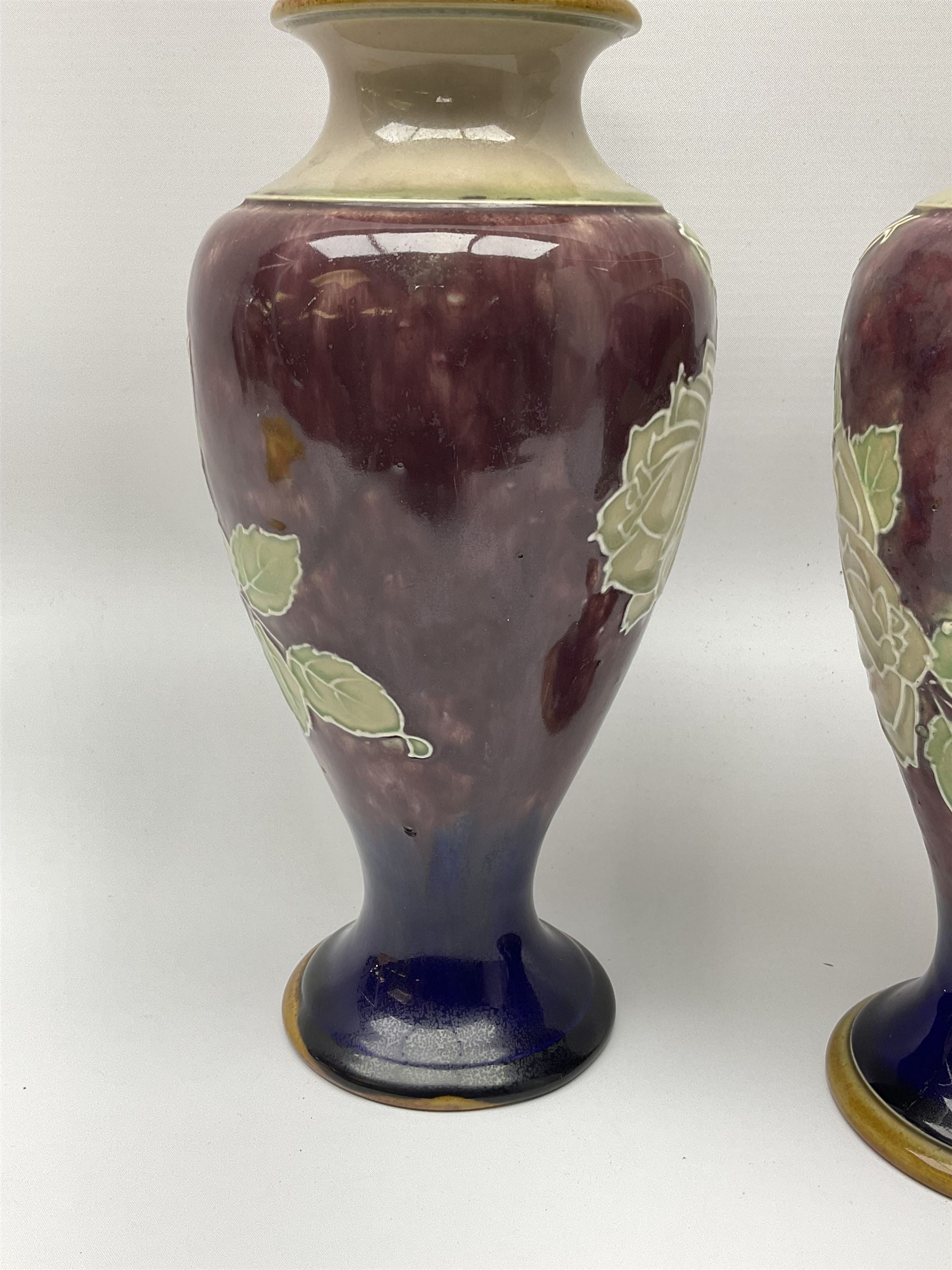 A pair of early 20th century Royal Doulton stoneware vases, of baluster