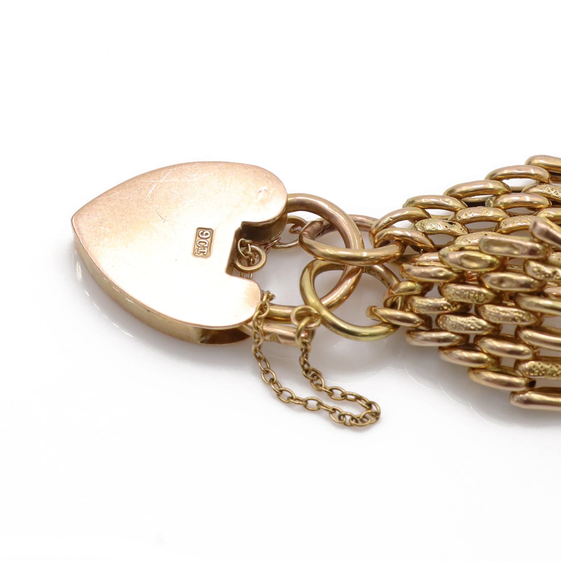 Early 20th century 10ct rose gold gate bracelet, with heart locket clasp stamped 9ct