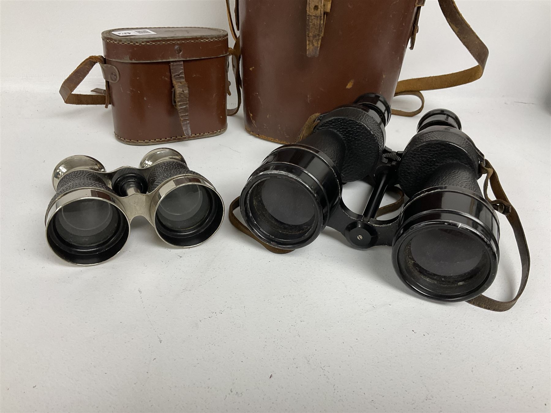 Pair of racing binoculars in leather case, together with a pair of Ross London Steplux binoculars no.149664 in leather case  