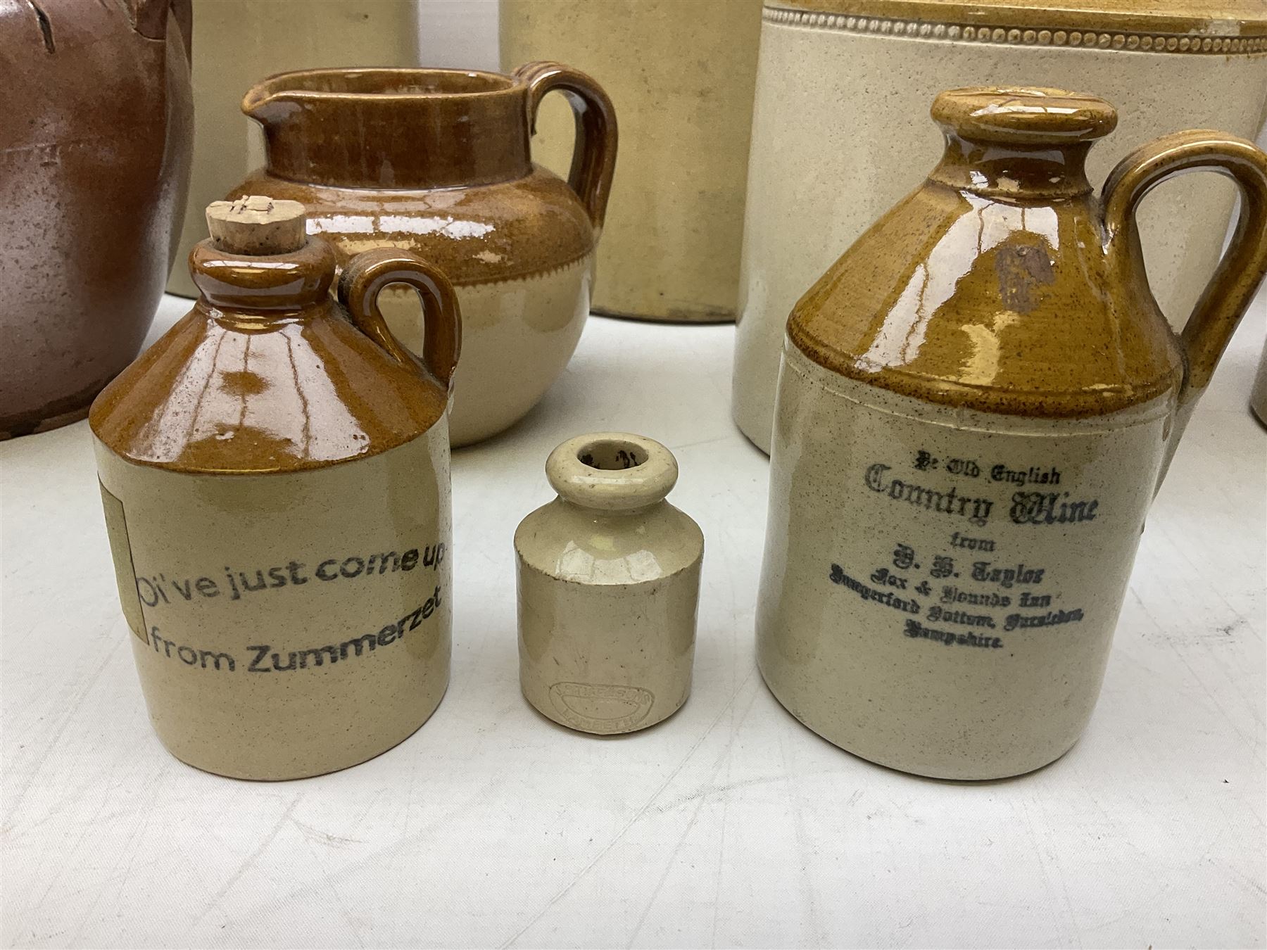 Quantity of salt glazed stoneware flagons, two tone jars and jug etc, to include some with impressed marks and labels, largest H26cm
