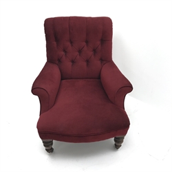  Victorian Howard style armchair, upholstered in a deep buttoned red fabric, turned supports, W83cm  