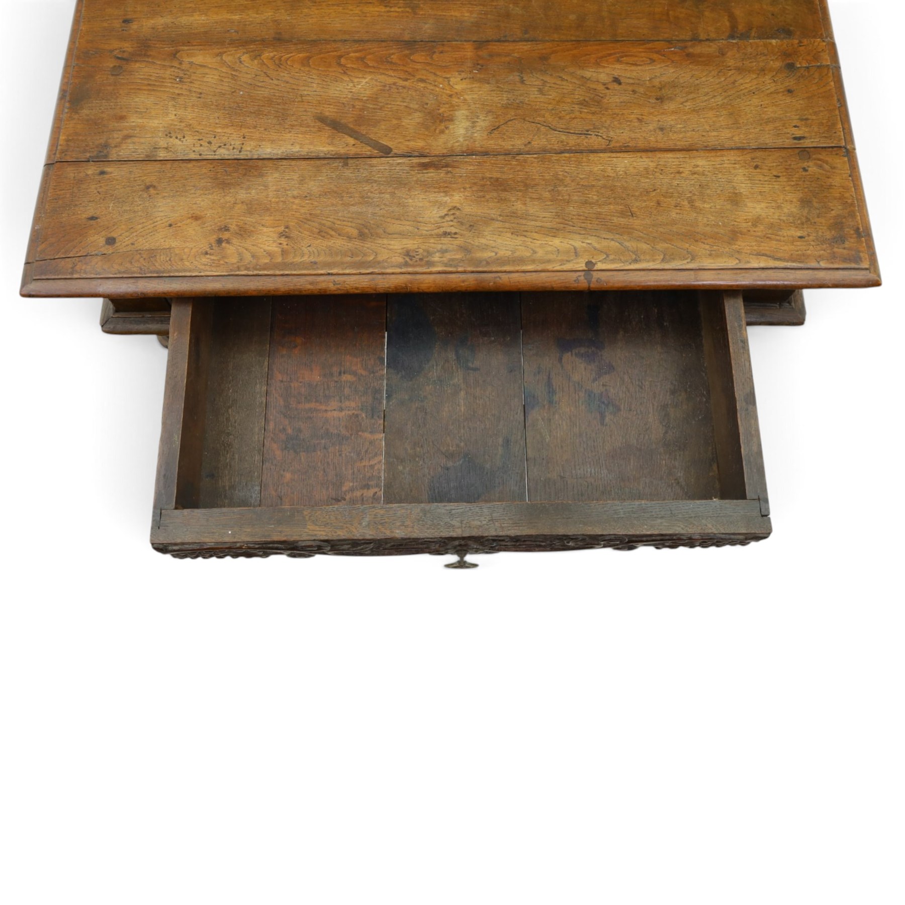 18th century oak lowboy, rectangular top with moulded edge, fitted with single frieze drawer carved with scrolling fruiting vines and stylised plant motifs, raised on bobbin-turned supports united by box stretcher 