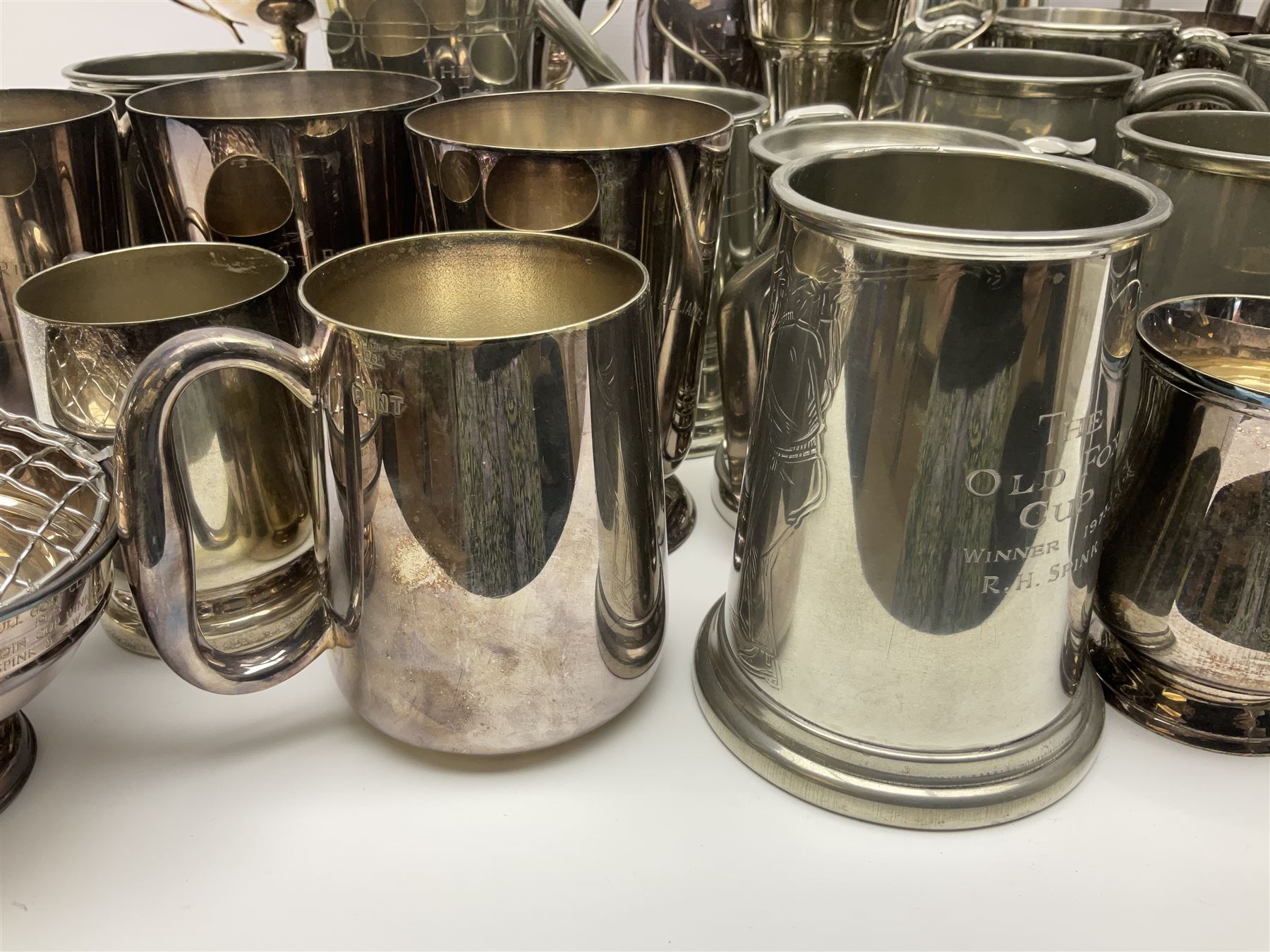 Collection of pewter and silver-plated trophy cups and presentation tankards, largest H28cm

