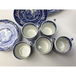 Spode blue and white Italian pattern dinner and tea wares, comprising five dinner plates, four side plates, seventeen side plates, four bowls, ten tea cups and twenty one saucers, five coffee cans and six saucers, and a flan dish, with blue and black printed marks beneath 