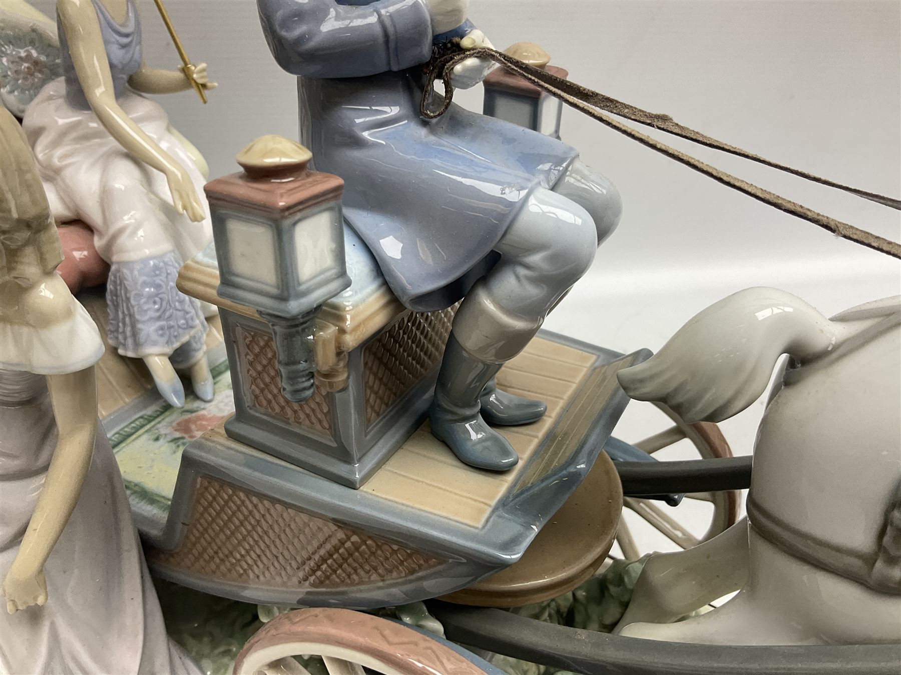 Large Lladro figure, The Landau Carriage, modelled as a horse drawn open top carriage, on a mahogany base, no 1521, sculpted by Juan Huerta, year issued 1987, year retired 1998, H30cm 