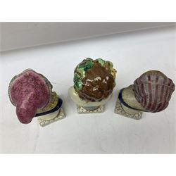 19th century pair of hand painted ceramic busts of children, together with a third similar example of a putti with a crown of ivy, tallest H23cm 