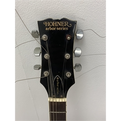 Hohner Arbor Series electric guitar in black and elm effect, serial no.E714703, L101cm; together with an acoustic guitar L102cm; with two Kinsman folding stands (4)