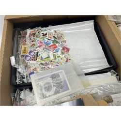 Mixed stamps, mostly loose on pieces, used World stamp sheets etc, in three boxes