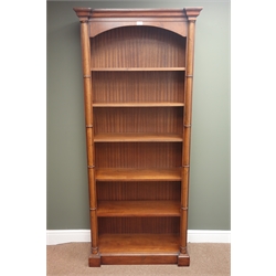  Victorian style mahogany 6' open bookcase, projecting cornice, collar turned half columns enclosing five shelves, plinth base, W34cm, H195cm, D84cm  