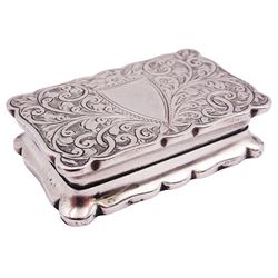 Early 20th century silver snuff box, of rectangular form with shaped edge, the hinged cover engraved with vacant cartouche, and both cover and underside engraved with foliate scrolls, opening to reveal a gilt interior, hallmarked Robert Chandler, Birmingham 1919, W5cm, approximate weight 1.28 ozt (39.9 grams)