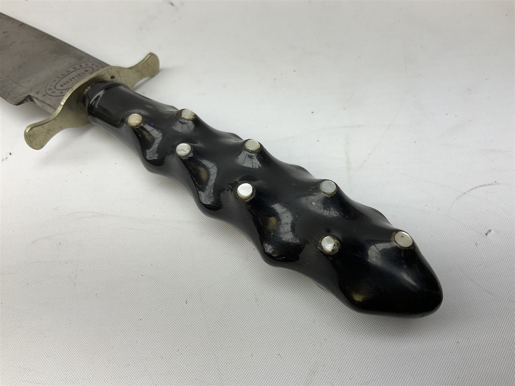 Hunting knife by J Nowill & Sons, Sheffield, the handle inset with mother of pearl, blade length 19cm; George Wolstenholme IXL lock-knife with antler scales L29cm open; and another Bowie style hunting knife marked 'V.R. Warranted Sheffield Joseph Ellis & Sons' in leather sheath (3)