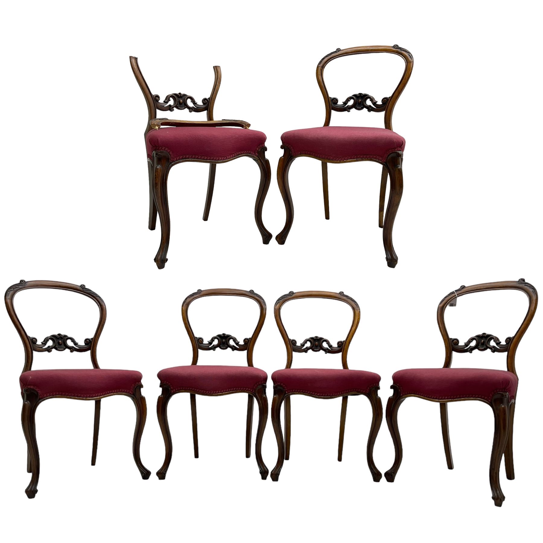 Set of six Victorian rosewood dining chairs, the balloon back carved with foliage scrolls, cartouche carved middle rail with extending scrolls, the seats upholstered in pink fabric, on carved cabriole supports with scrolled terminals 
