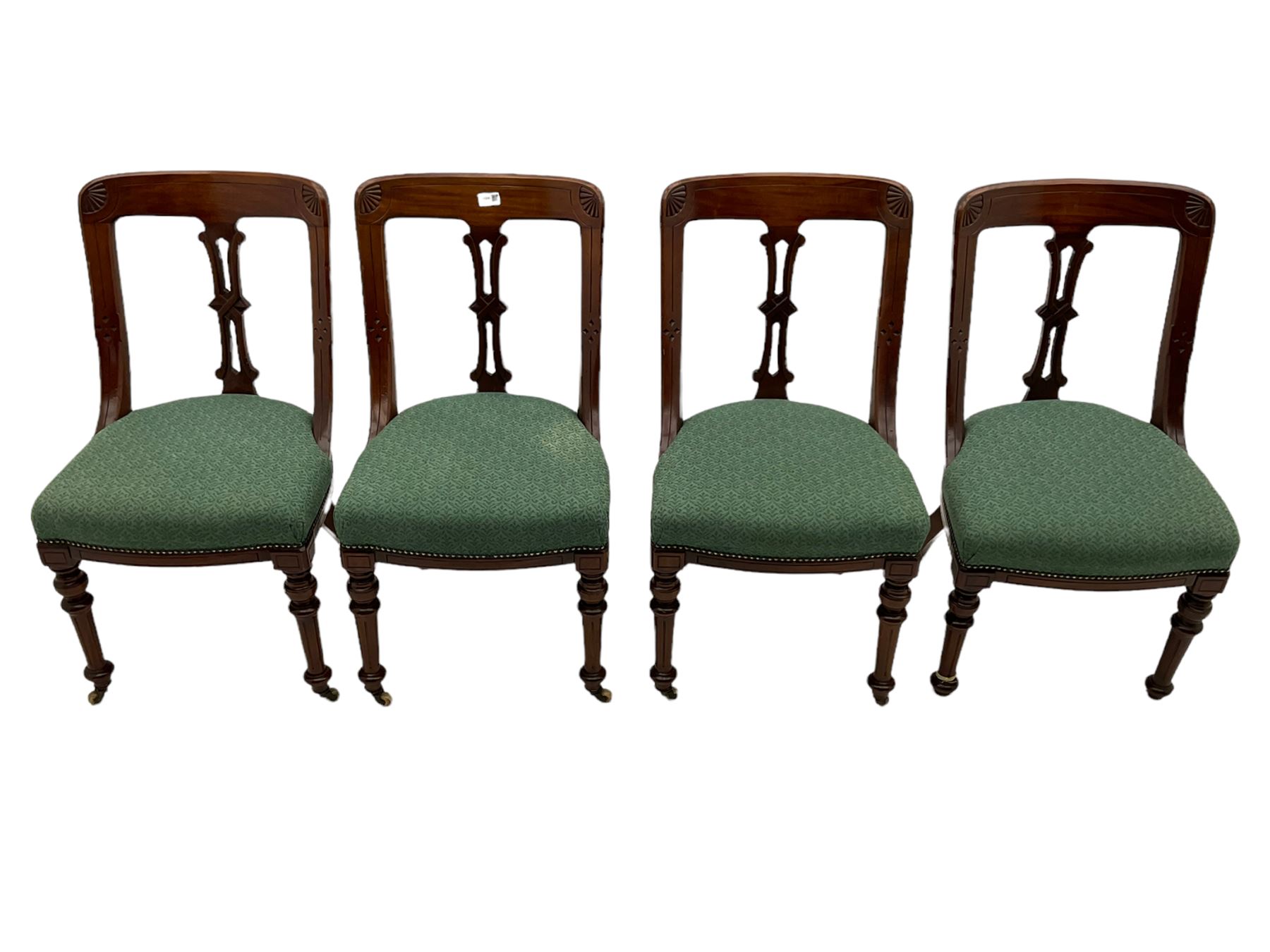 Set of four Victorian mahogany spoon back dining chairs, upholstered seats