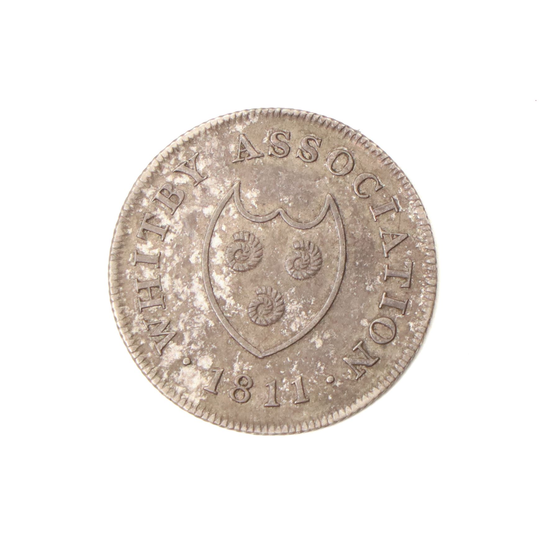 Whitby Association silver shilling token 1811 and a Cattle & Barber York silver shilling token 1811 