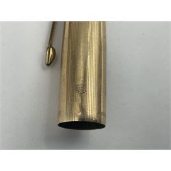 Three rolled gold Parker fountain pens, comprising an example with a gold nib marked 14K 585 and barrel with a shell stamp, a Parker 61 fountain pen with inset gold arrow to the nib, and another similar, all with striated decoration and arrow clips to the caps, L13cm, one with box